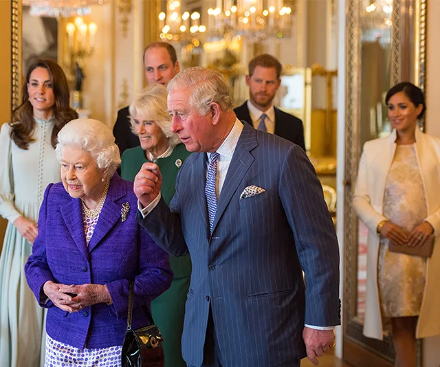Royal family gathering in an elegant room.