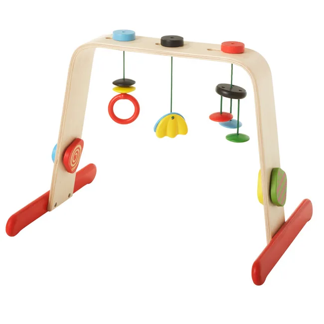 Colorful wooden baby gym with hanging toys in various shapes and colors.
