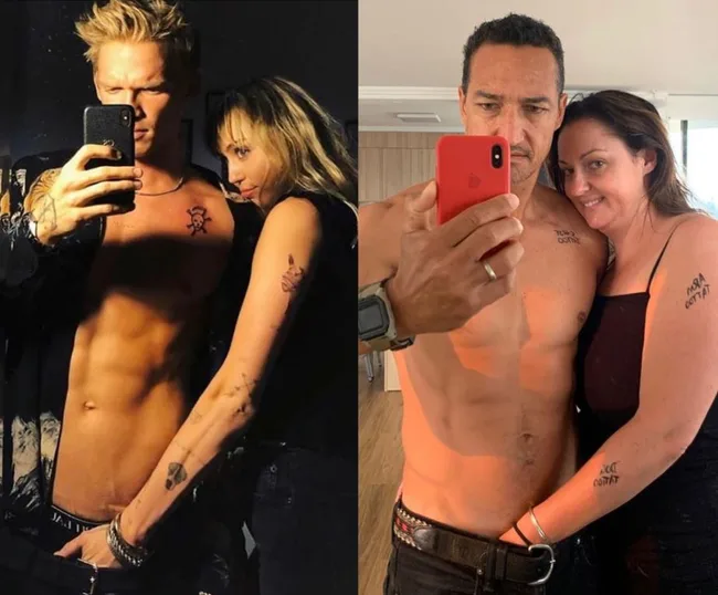 Two couples taking selfies in front of a mirror, both couples have matching tattoos and are embracing each other.
