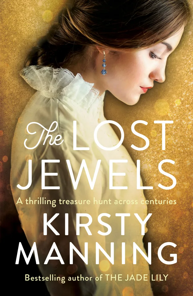 Cover of "The Lost Jewels" by Kirsty Manning, featuring a woman in profile with blue earrings and a lace collar.