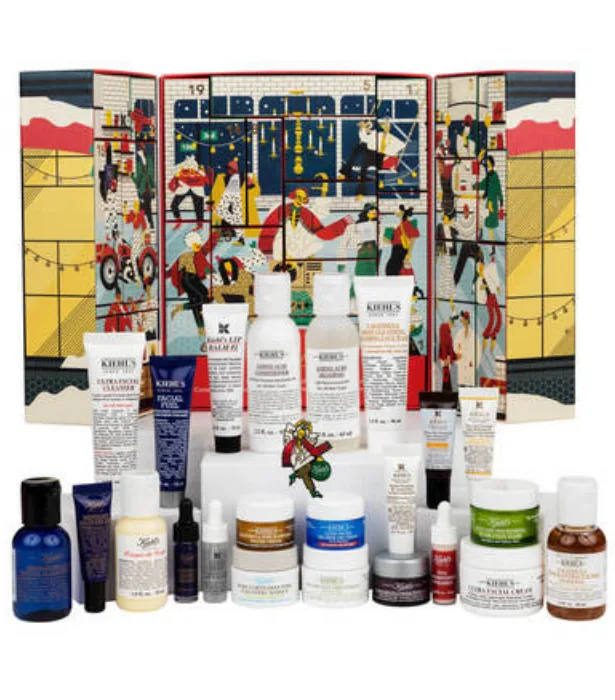 Kiehl's advent calendar displaying a variety of skincare and beauty products with a festive background.