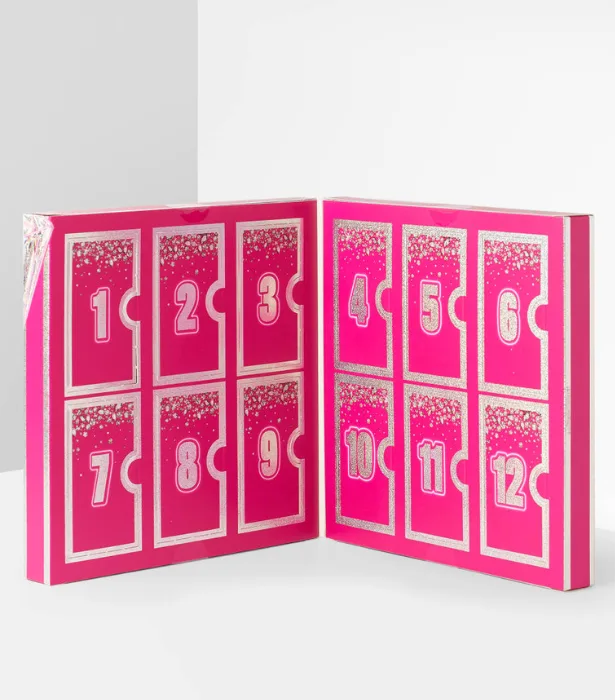 Pink advent calendar with 12 numbered doors, decorated with silver glitter.
