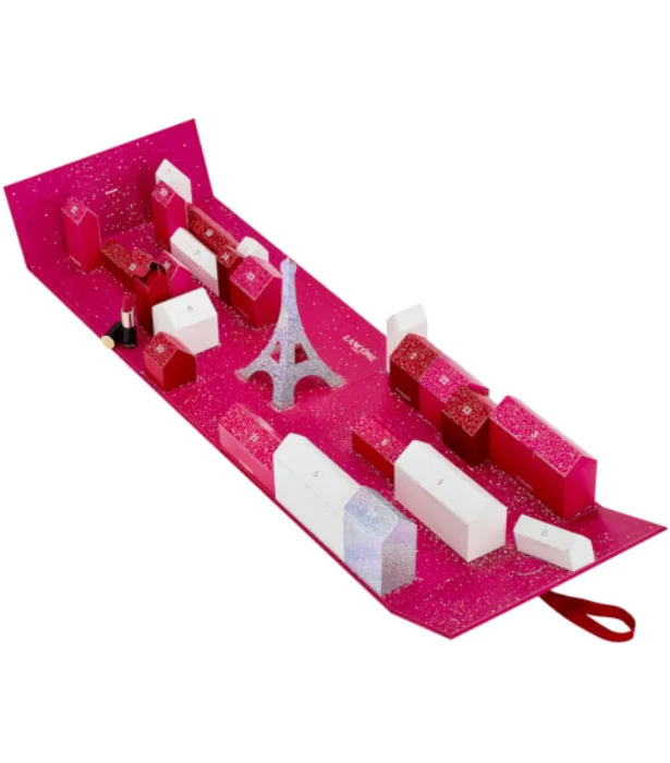 Lancome advent calendar with Eiffel Tower design, pink and white boxes, and a small lipstick on the side.