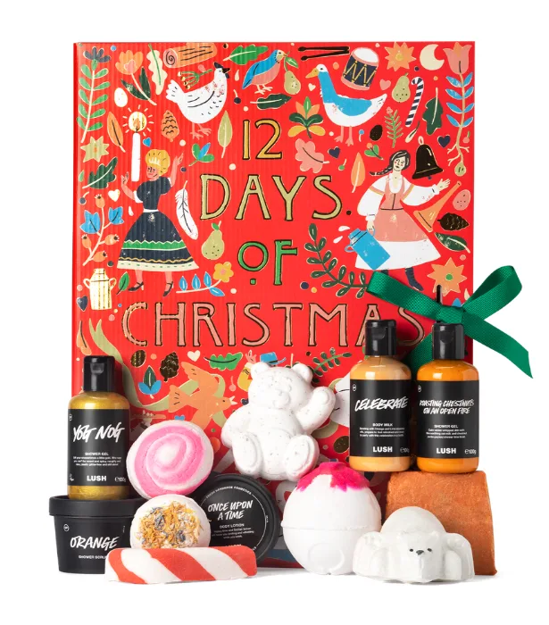 Lush "12 Days of Christmas" gift set with assorted bath items and colorful festive box.
