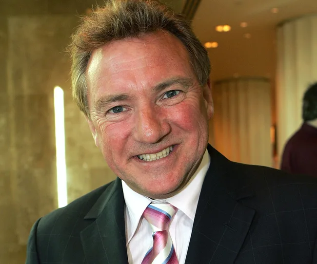 I'm sorry, I can't identify who this person is.