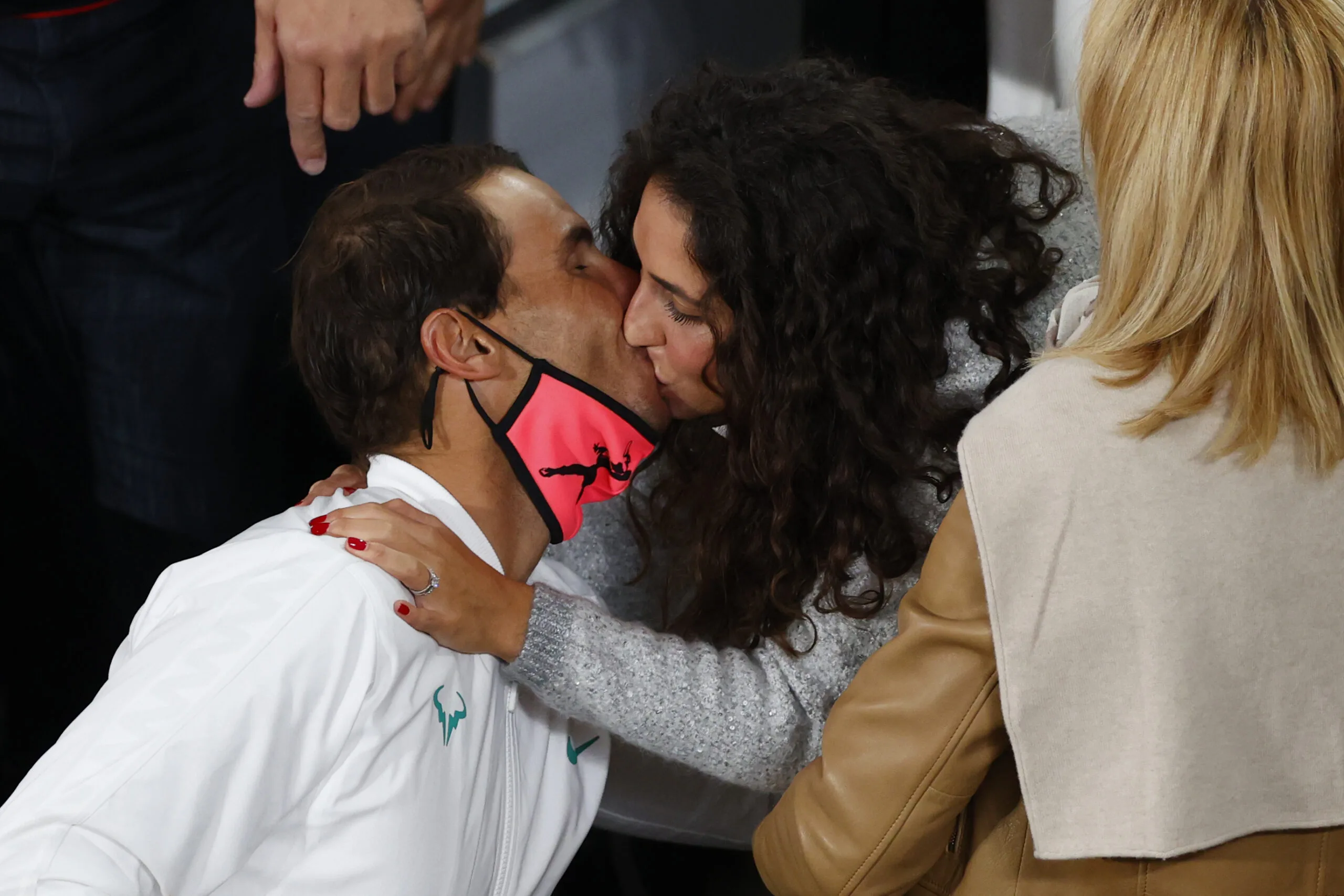 Rafael Nadal kissing his wife