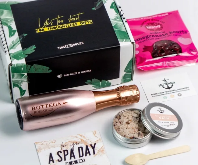 Gift box containing Bottega Rose Gold, pomegranate hearts, spa voucher, and The Salt Parlour products.