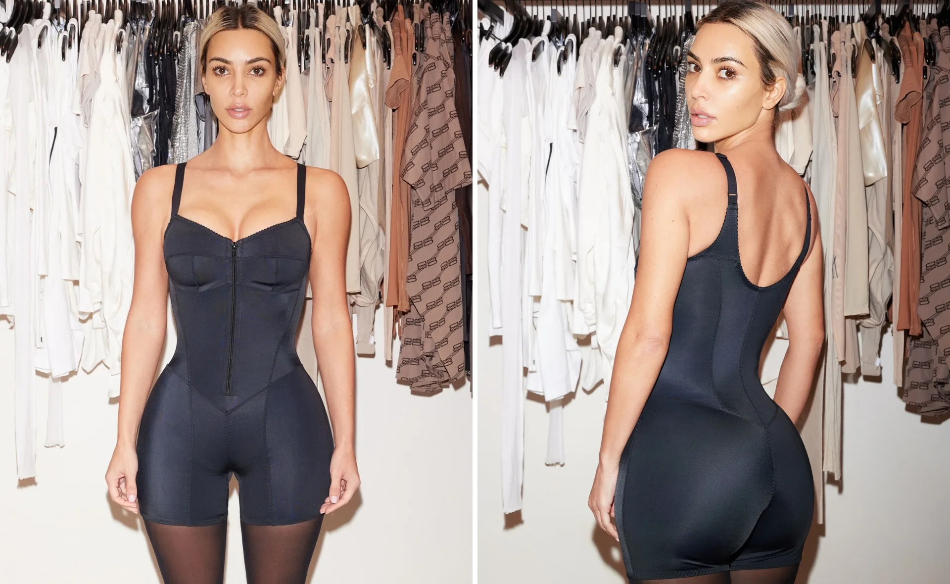 Woman wearing black shapewear in front of a closet with various clothes hanging.