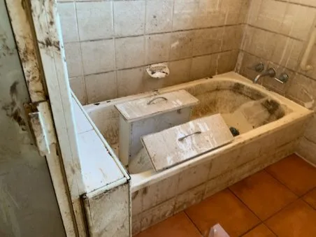 Mud lined the walls, and silt left from the floods covered everything. Image: Supplied