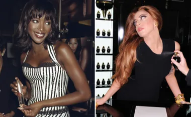 Two women in elegant attire holding perfume bottles, one with short hair smiling, the other with long hair in a black dress.