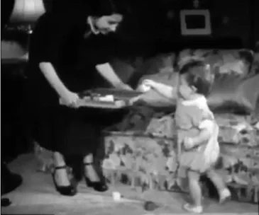 Never before seen footage of the Queen and baby Charles playing
