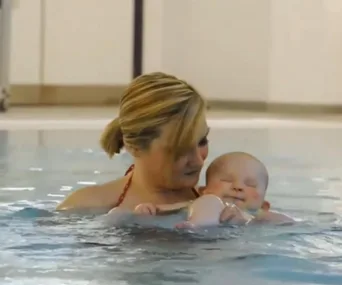 Baby born with no eyes finds joy swimming