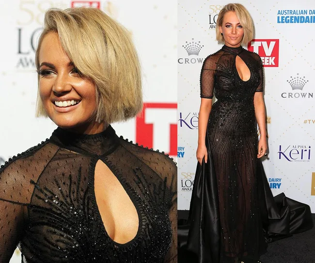 Blonde woman in a black beaded gown on a red carpet at an awards event, smiling with a stylish bob haircut.