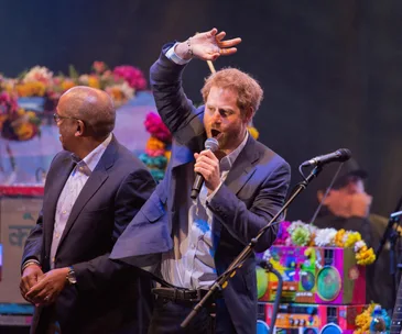 Prince Harry joins Coldplay on stage