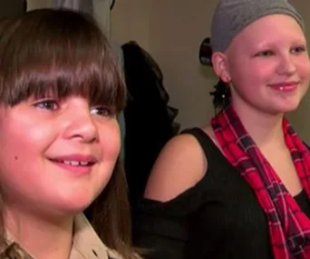 Boy grows hair long for best friend who has none