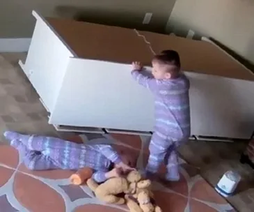Heart-stopping moment 2-year-old boy saves his twin after chest of drawers almost crushes him