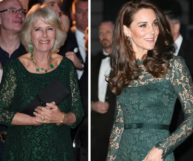 Two women in elegant green lace dresses at a formal event, smiling with people in the background.