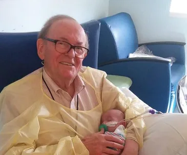 Meet the ‘ICU Grandpa’ who cuddles sick and premature babies when their parents can’t be there