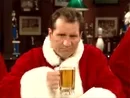 Man dressed as Santa Claus, holding a beer mug, sitting at a bar with a serious expression.