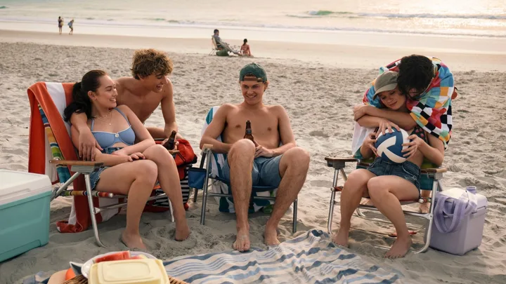 The Summer I Turned Pretty Season three cast on the beach