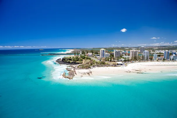 An aerial view looking at the famous Snapper Rocks and Rainbow bay at Coolanagatta on Queensland's Gold Coast