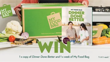 "Green My Food Bag box with fresh vegetables and 'Dinner Done Better' cookbook, promoting a giveaway contest."