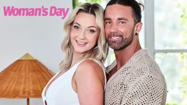 Couple smiling indoors, featured in Woman's Day magazine.