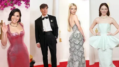 Four people posing elegantly at an event, each in formal attire on the red carpet.