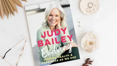 Book cover: "Judy Bailey Evolving: Finding Health & Happiness as We Age" with a smiling woman on the cover.