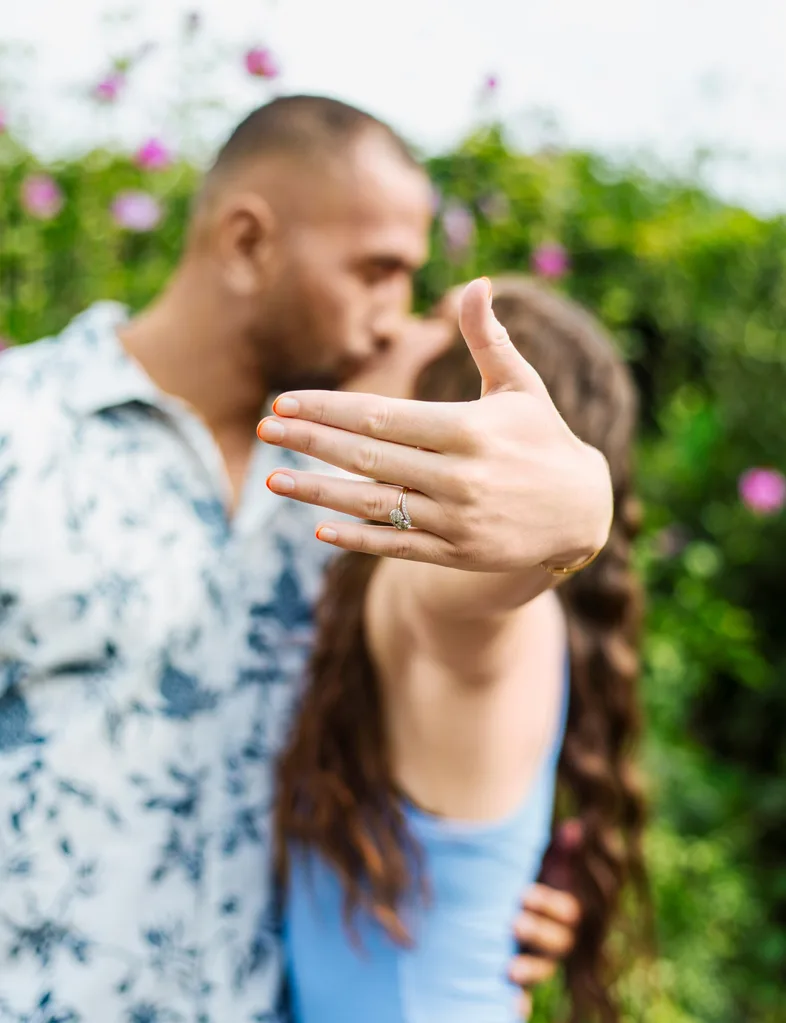 Erin shows off her ring with a kiss from Ben