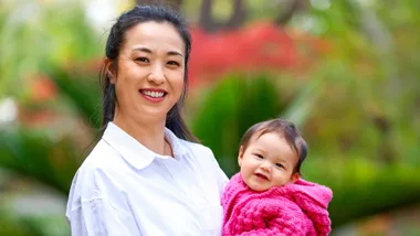 Yuki Sato holding daughter Iris