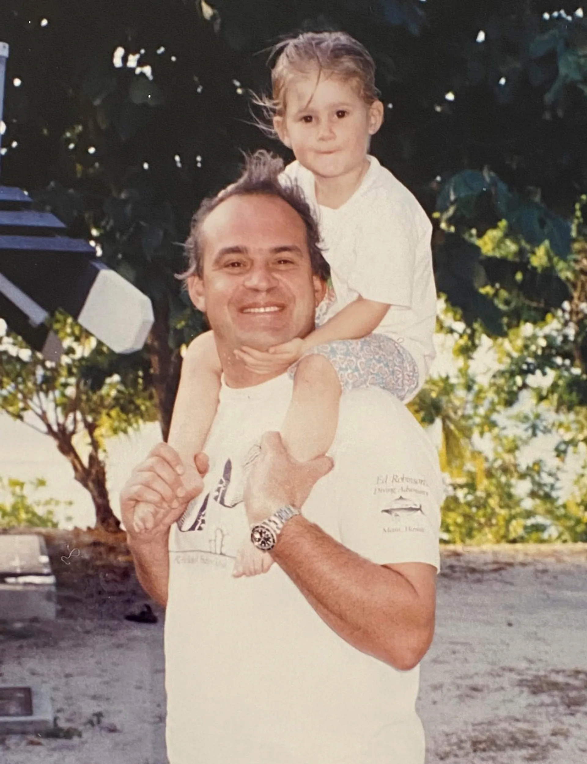 Young Izzy on dad Rob Fenwick's shoulders