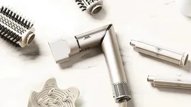 Shark FlexStyle hair dryer and styling attachments displayed on a light surface.