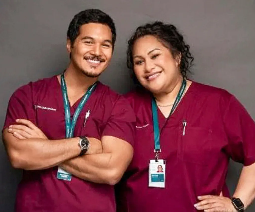 Bella Kalolo-Suraj in her Shortland Street uniform with co-star Theo Dāvid.