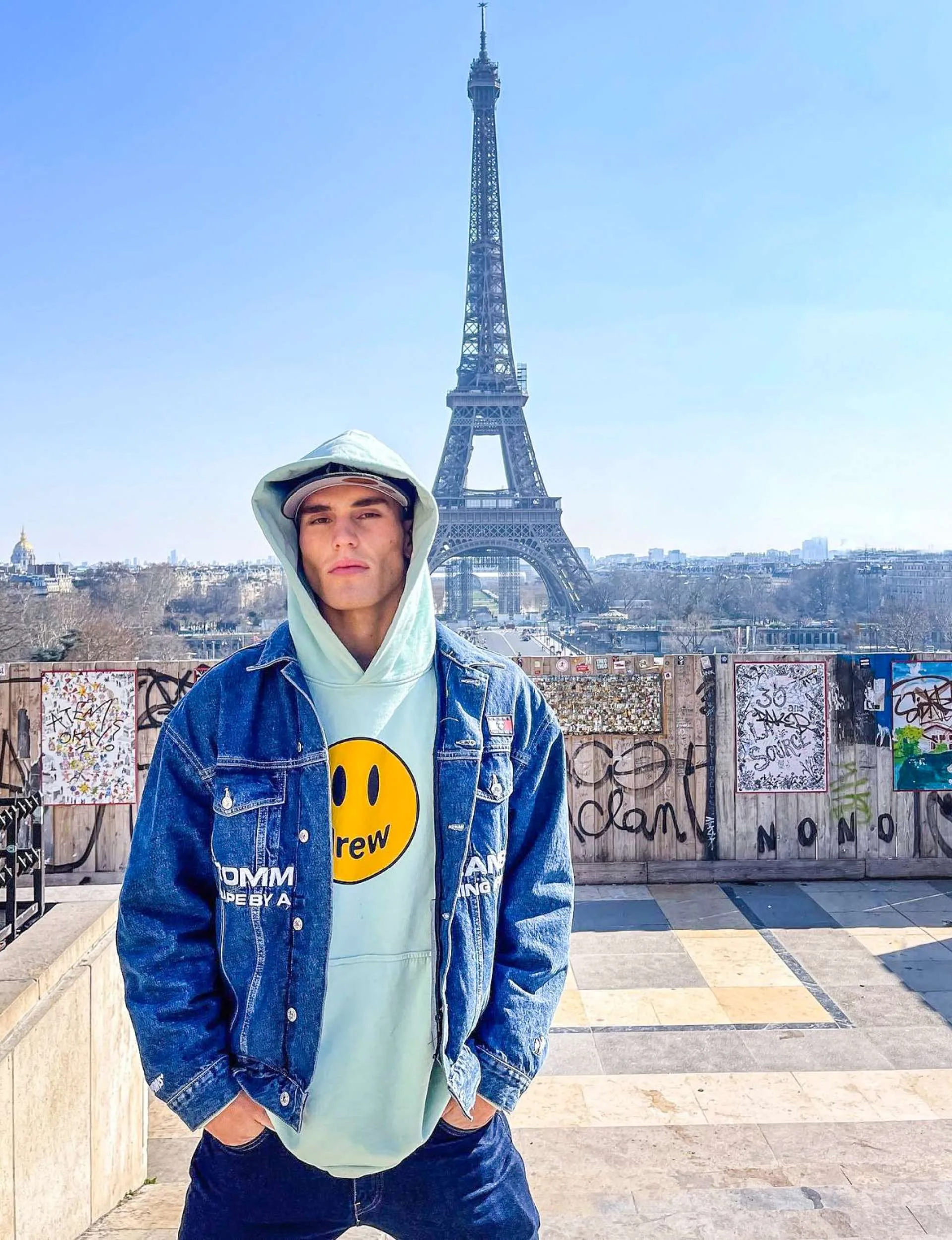 Josh standing in front of the Eiffel Tower
