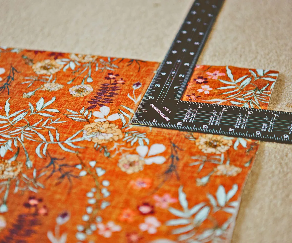 A right-angled ruler on top of the no-sew cushion fabric