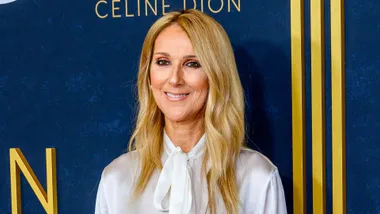 Celine Dion in front of a press wall