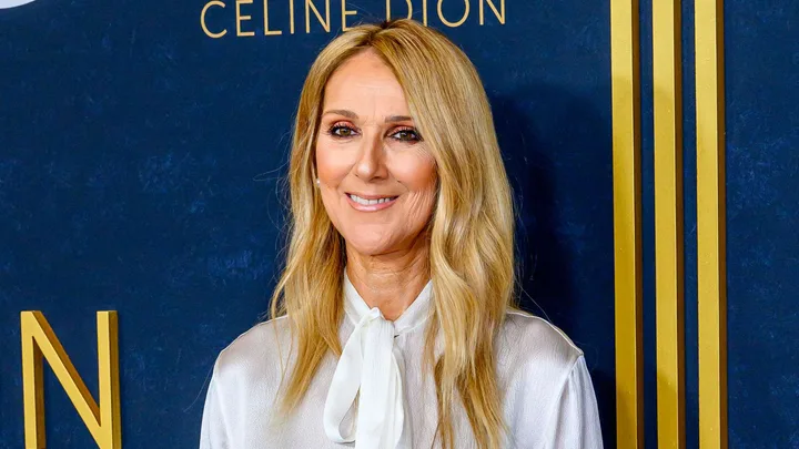 Celine Dion in front of a press wall