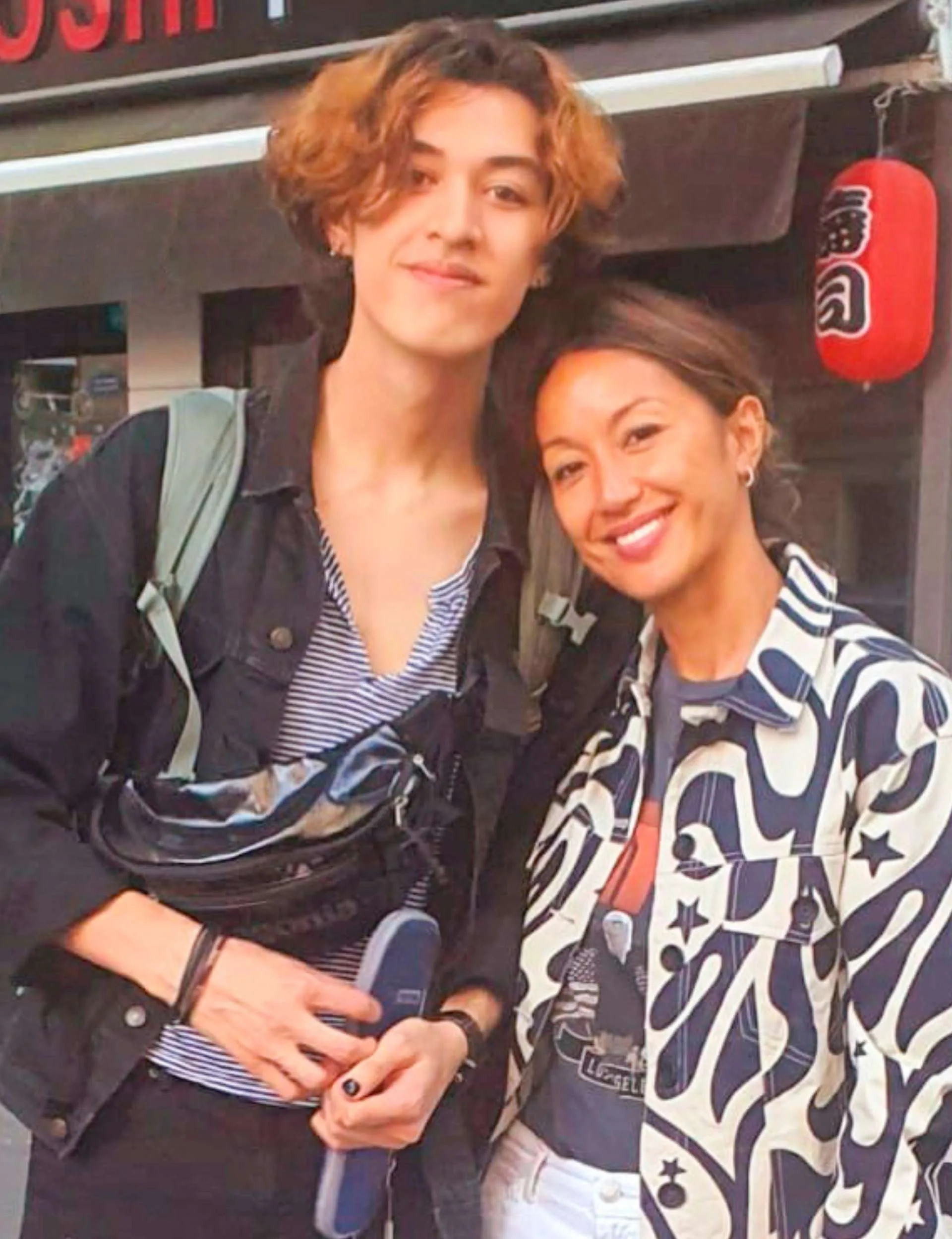 Ineke and son Ullrich in front of an Asian restaurant