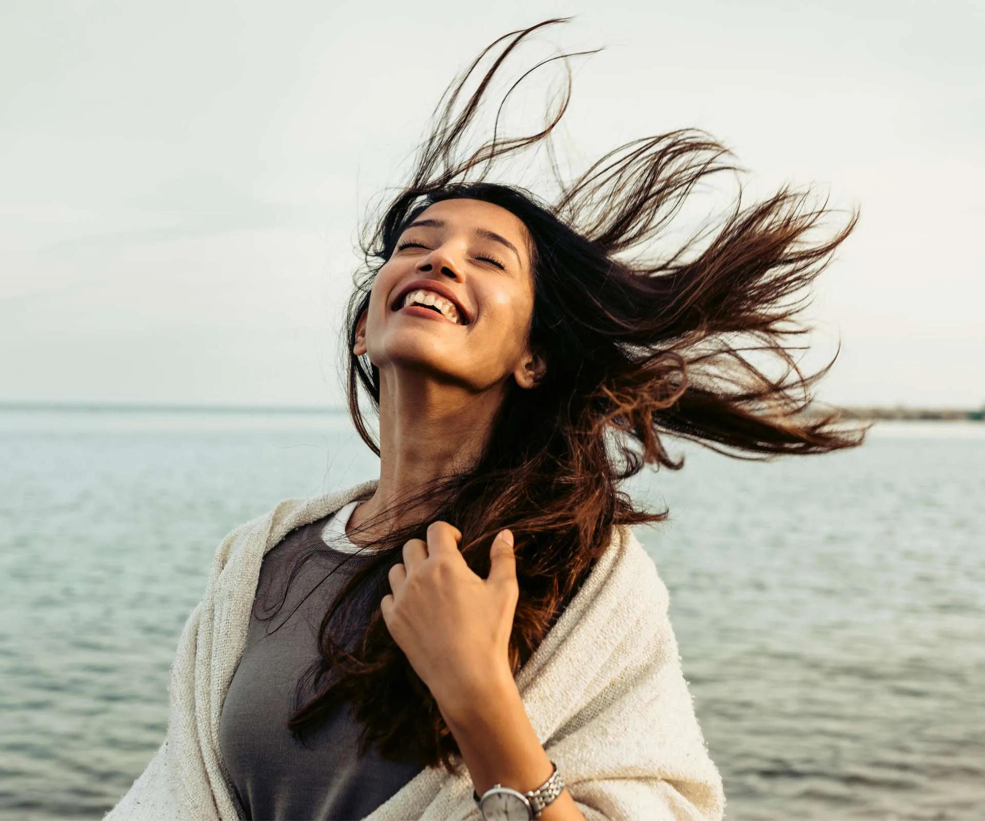 Woman with hair blowing in the wind