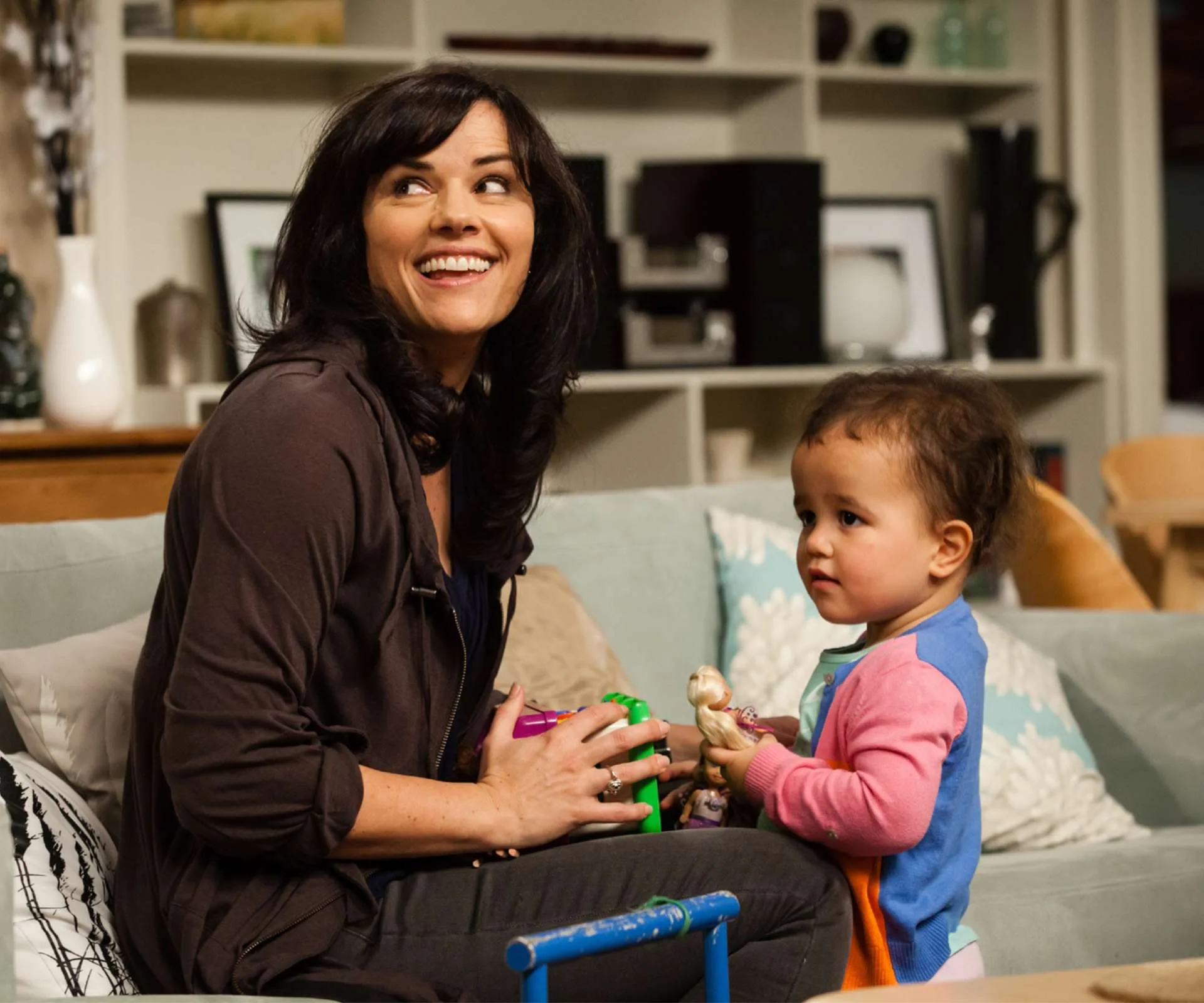 Amanda Billing on set of Shortland Street with a toddler