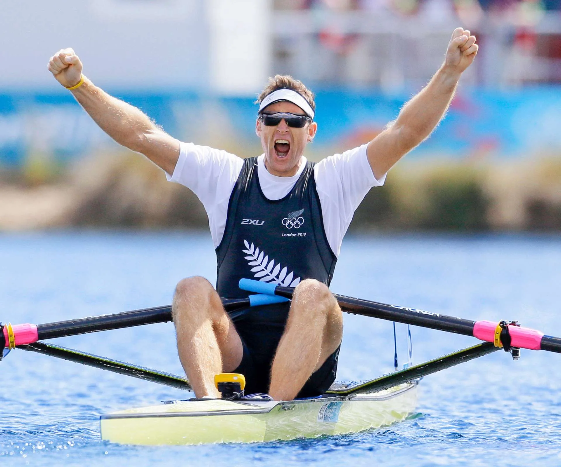 Mahé Drysdale sitting in his rowing boat celebrating his Olympic win