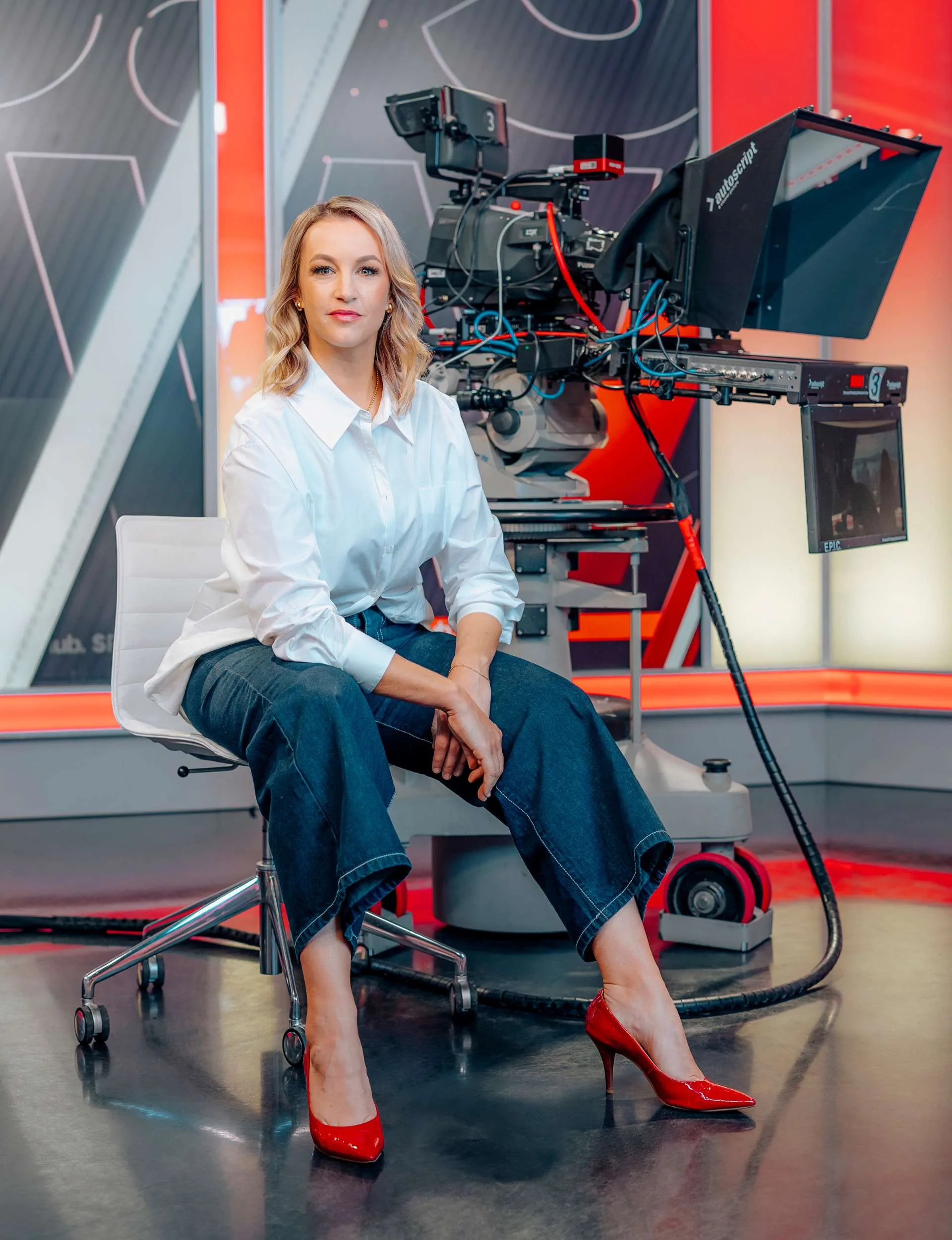 Janika ter Ellen sitting beside a Newshub camera
