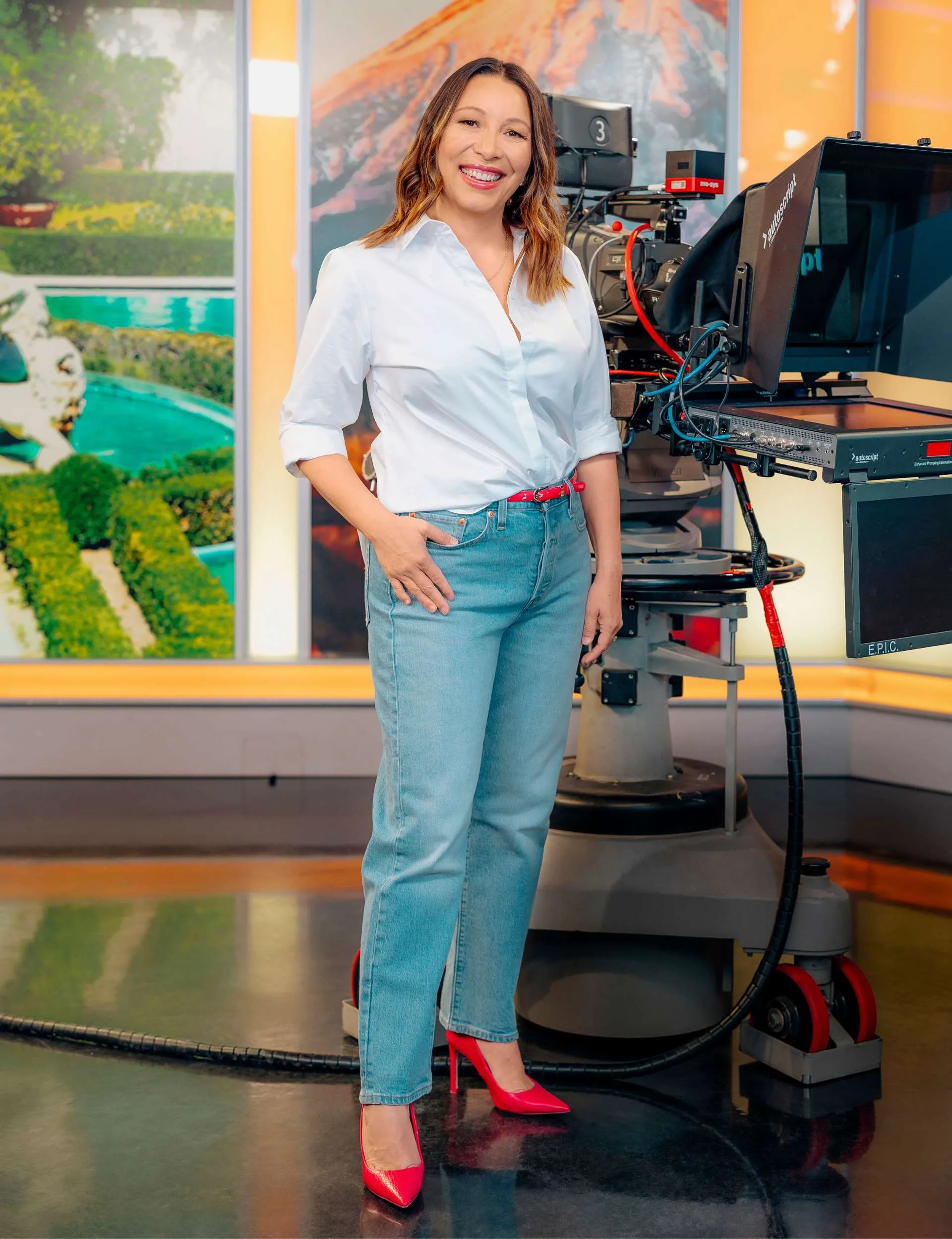 Melissa Chan-Green standing in front of  a Newhub camera