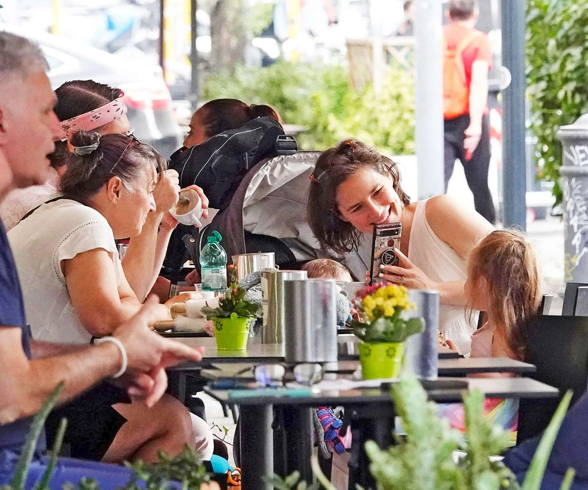 Amanda taking a photo of her kids at a restaurant