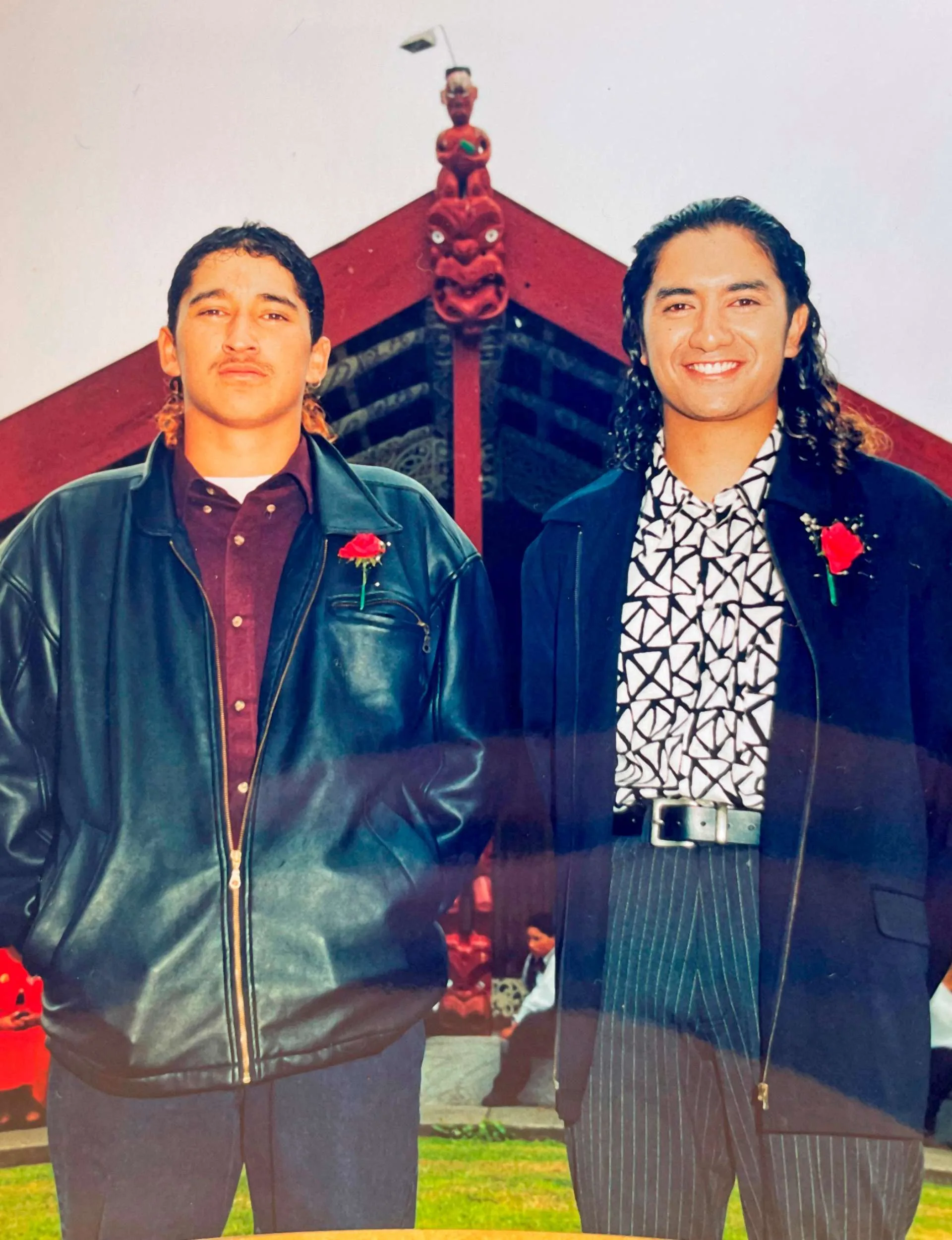 An old photo of Mātai and Hakim in front of a marae