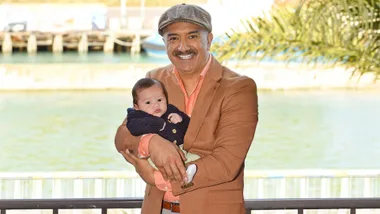 Mātai Smith holding baby Raekahu