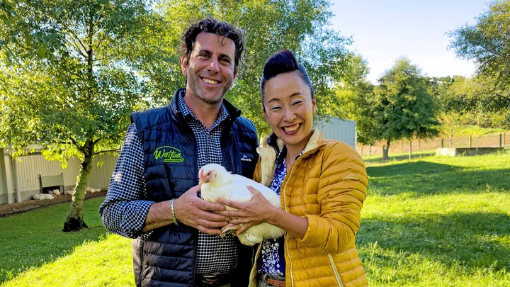 Waitoa chicken farmer Ibrahem Break, with Sachie Nomura holding a Waitoa Free Range chicken