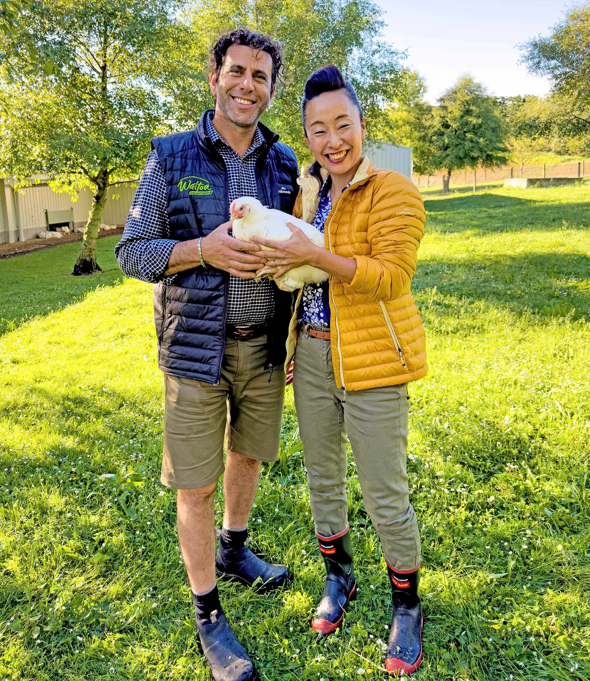 Waitoa chicken farmer, Ibrahem Break, with Sachie, holding a Waitoa free range chicken