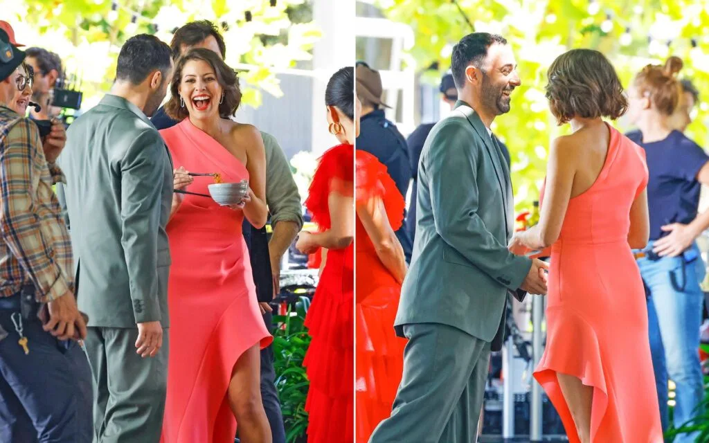 MasterChef judges Sofia and Andy in formal attire laughing together on set
